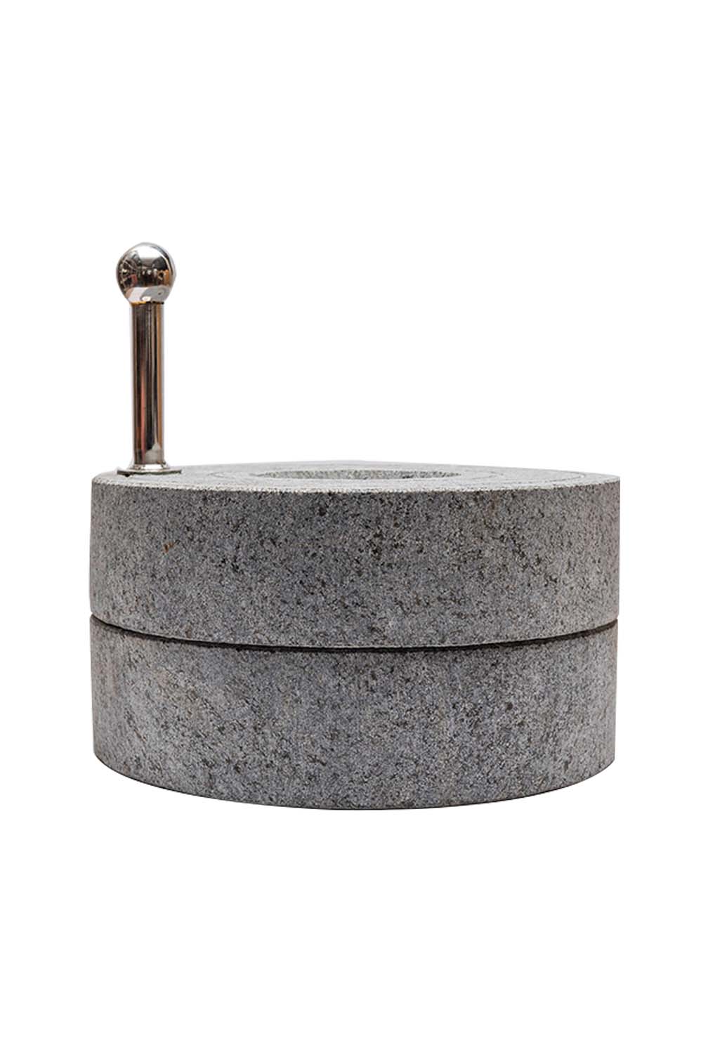 Atta Chakki Traditional Stone Mill on white background.