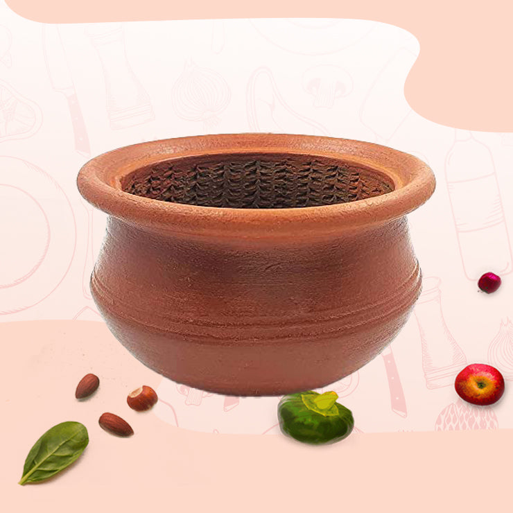 Clay keerai chatti used for Mashing traditional South Indian greens and dals using wooden Masher.