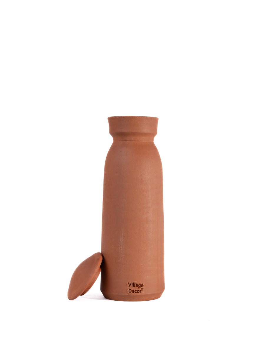 Clay water bottle with lid in matka style, handcrafted by Village Decor on white background
