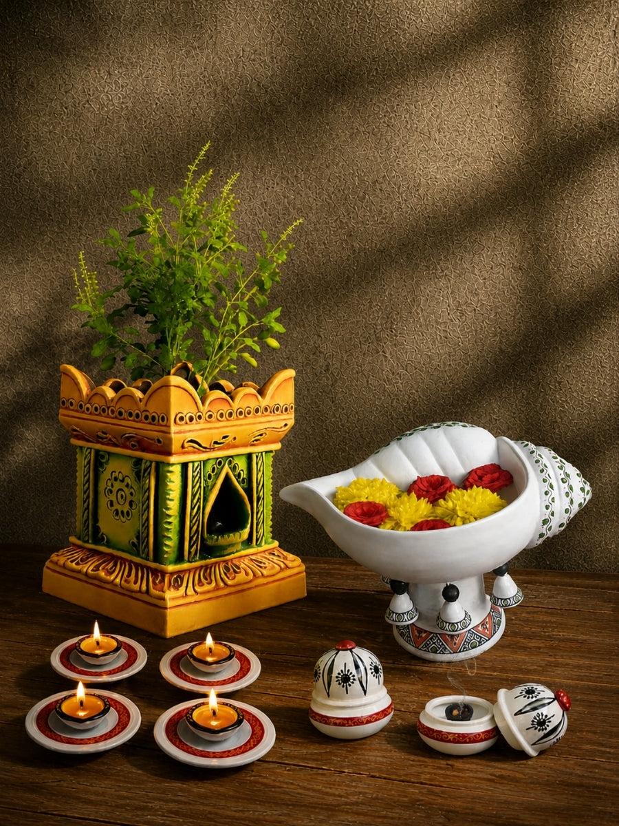 Lifestyle view of everyday pooja essentials combo with clay lamp, incense holder, plate agal vilakku and Tulsi Pot in a traditional home worship setup.