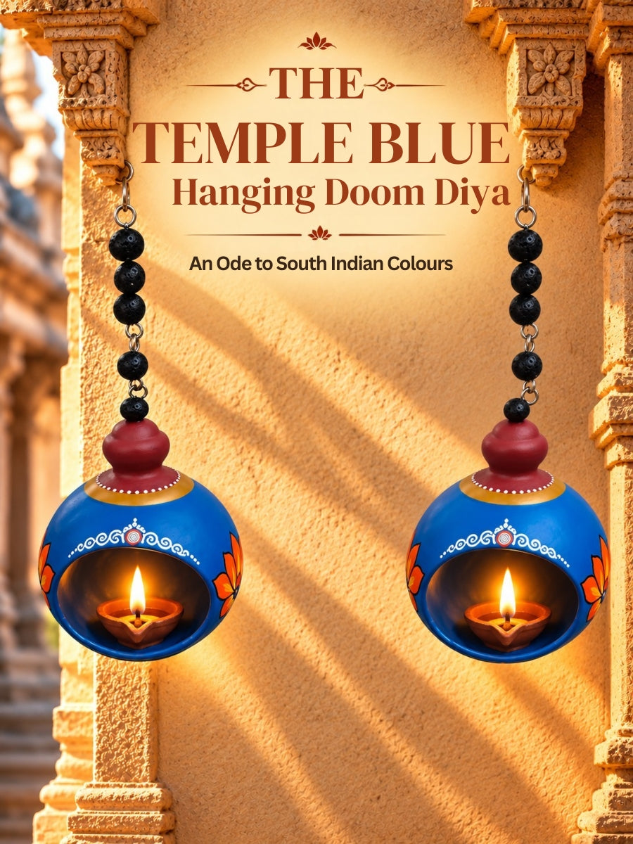 Temple blue hanging doom-shaped terracotta diya with traditional handpainted details, designed for hanging decor, pooja rituals, and festive home decoration.