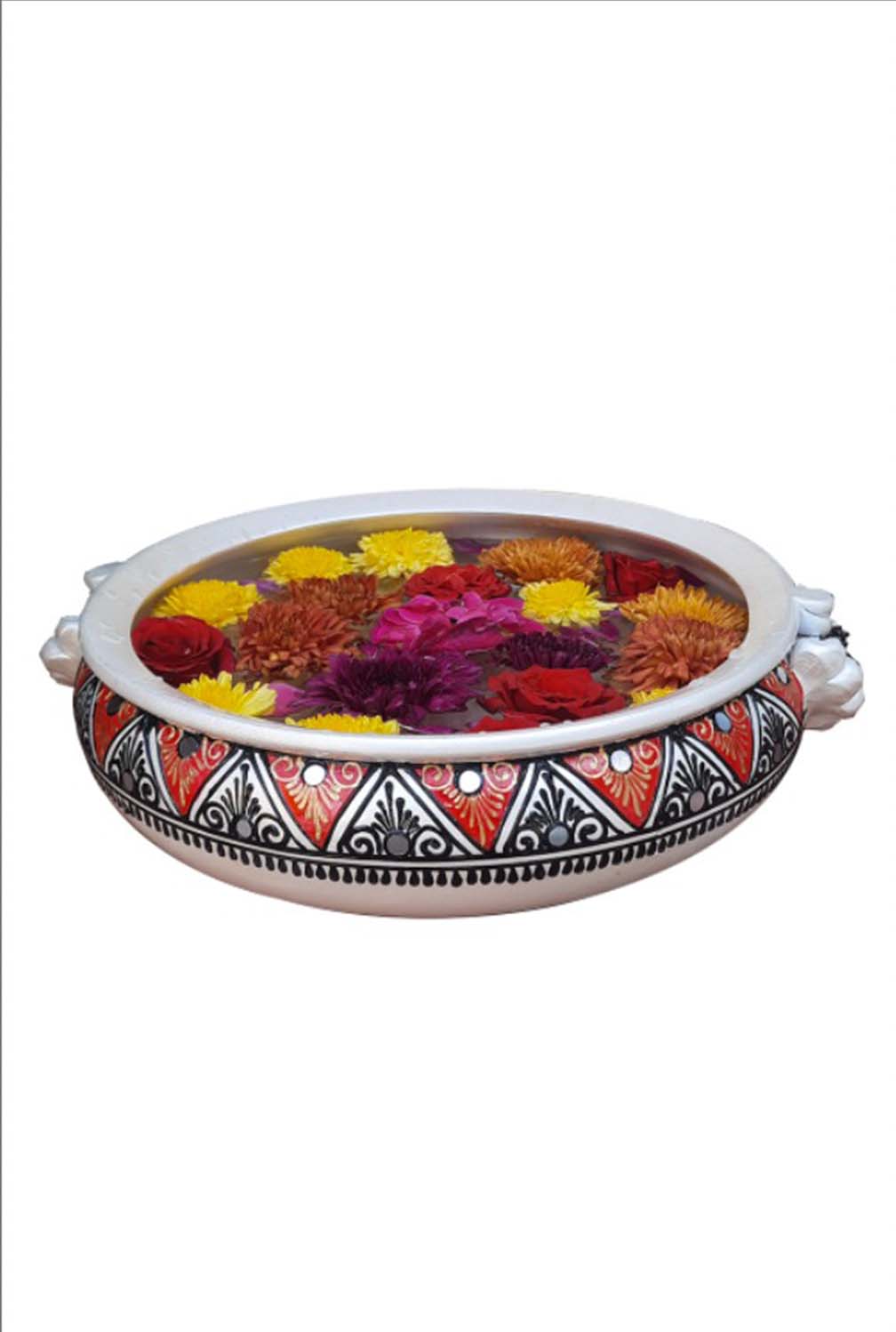 Top view of a colorful handpainted terracotta urli with floral art, placed on a white background, ideal for festive decor or pooja setups.