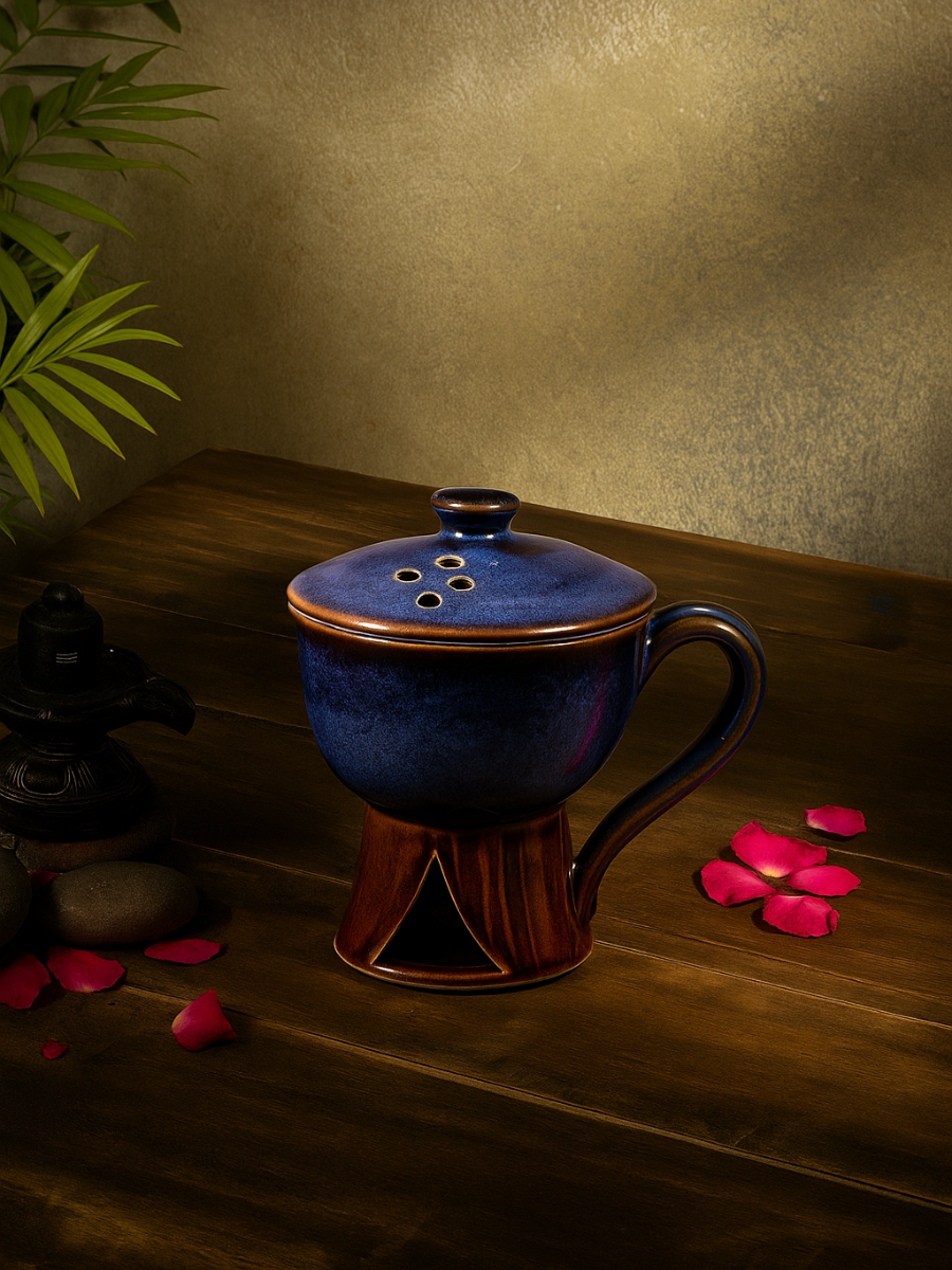 Ceramic incense holder with lid, designed for burning sambrani and dhoop during pooja rituals, ideal for spiritual practices and peaceful home decor.