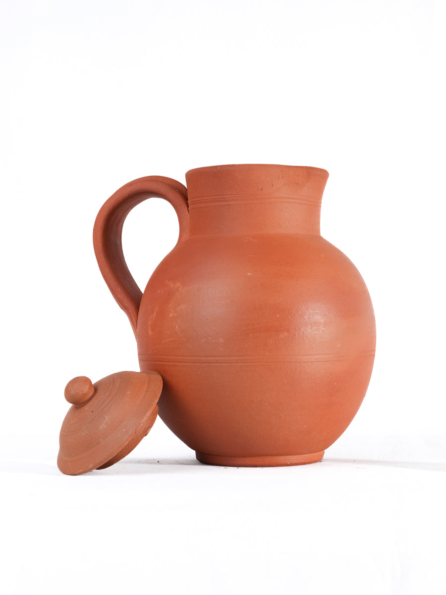 Clay water Jug with lid in matka style, handcrafted by Village Decor on white background.
