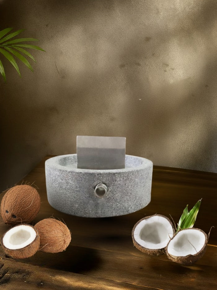 Coconut Breaker on a wooden table along with the coconut on the side.