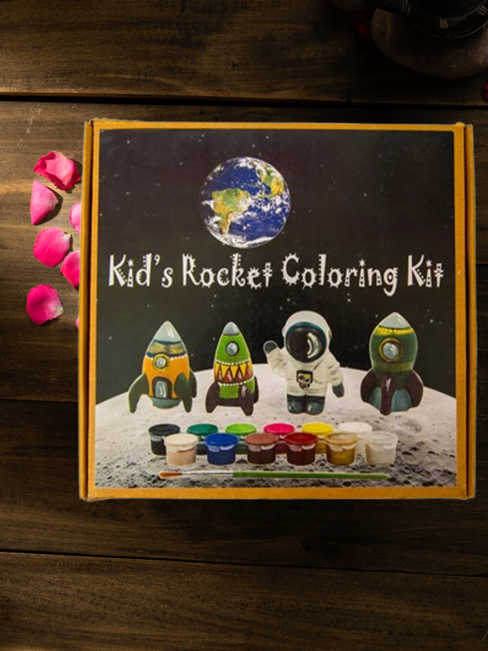 DIY clay rocket painting kit for kids with rockets, astronaut figure, and color paints displayed in a space-themed box