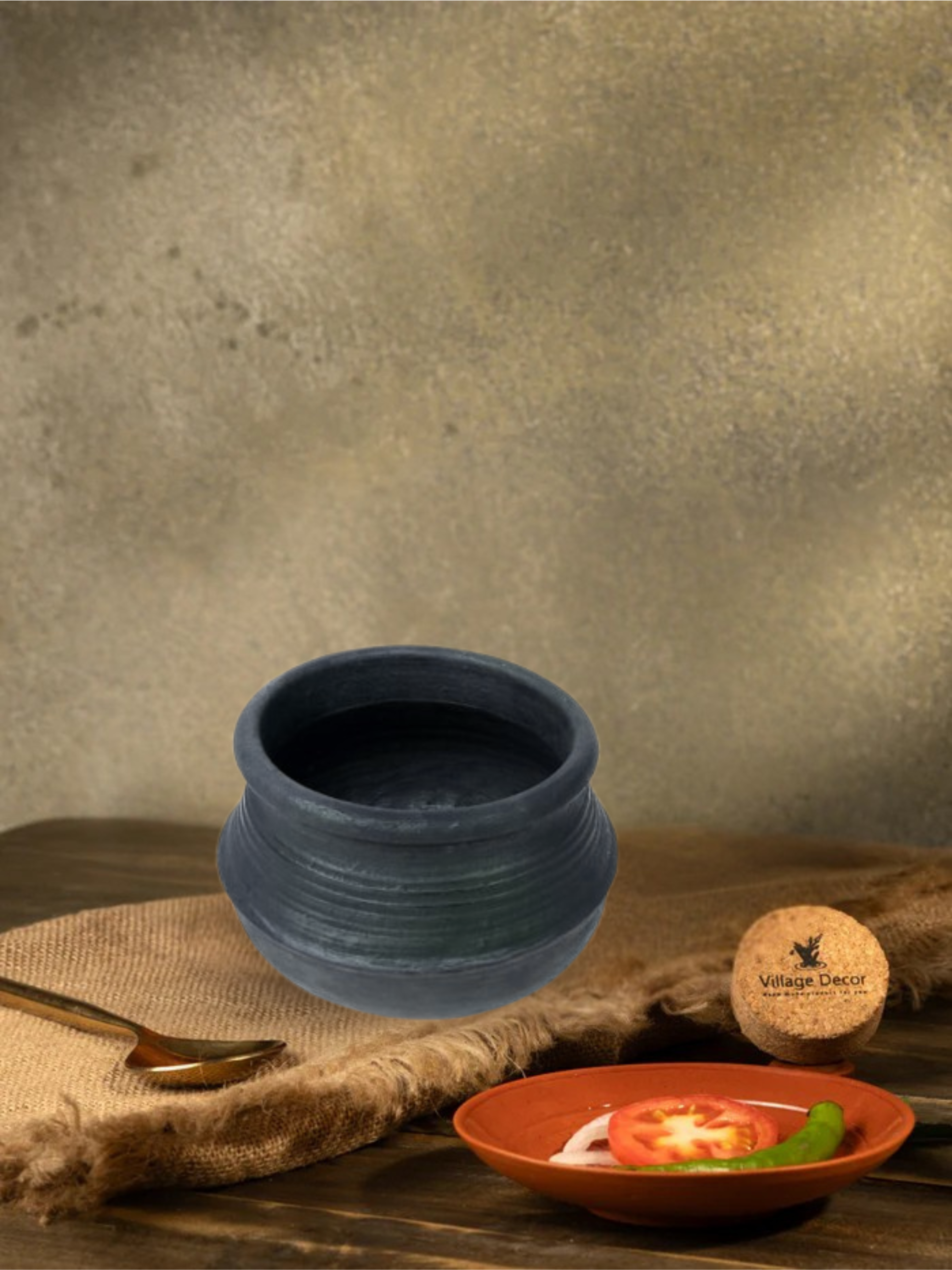 Earthen Black clay cooking pot ideal for preparing a variety of traditional dishes like Rasam, Porridge and more.