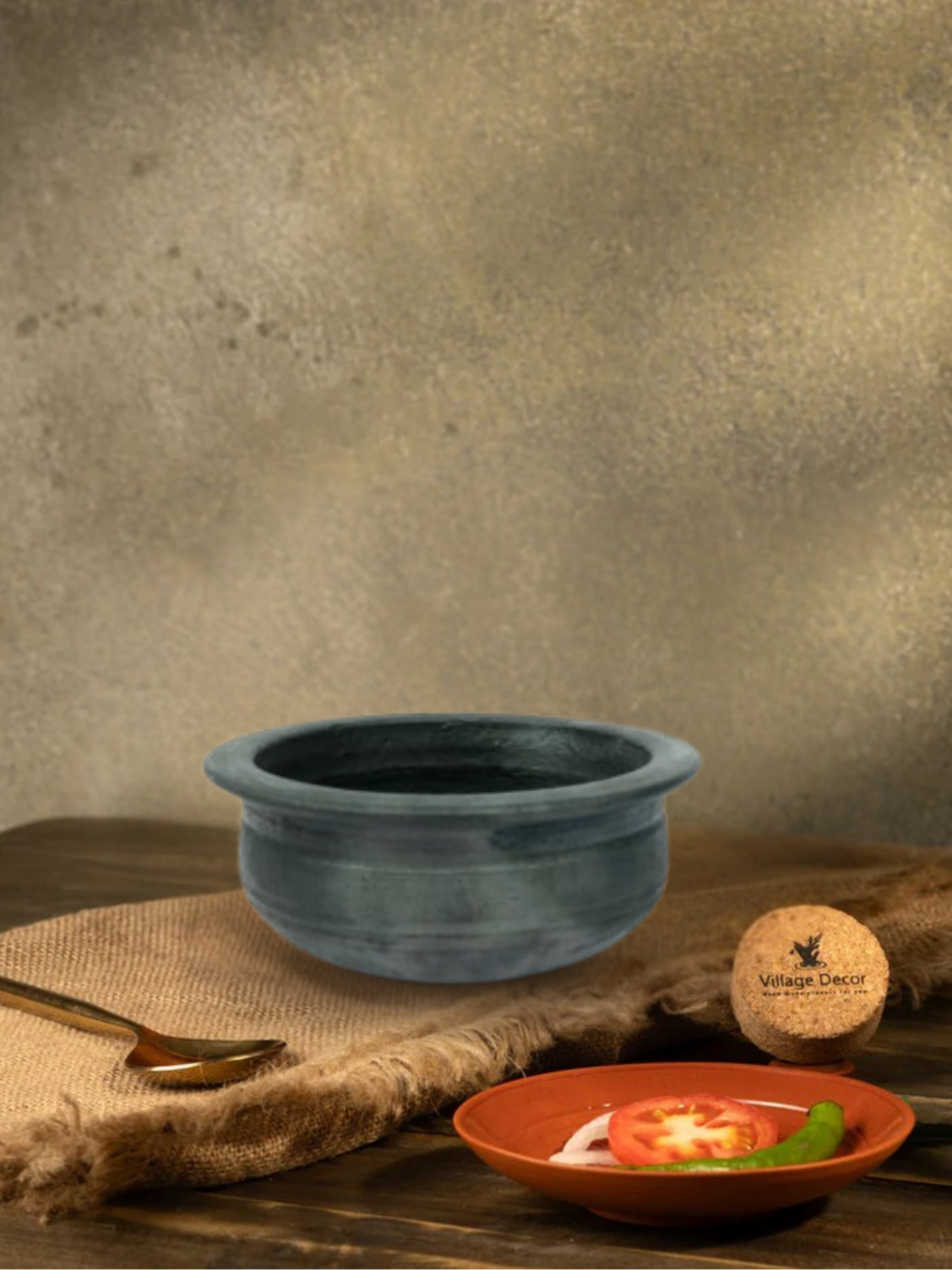 Earthen Black clay cooking pot ideal for preparing a variety of traditional dishes.