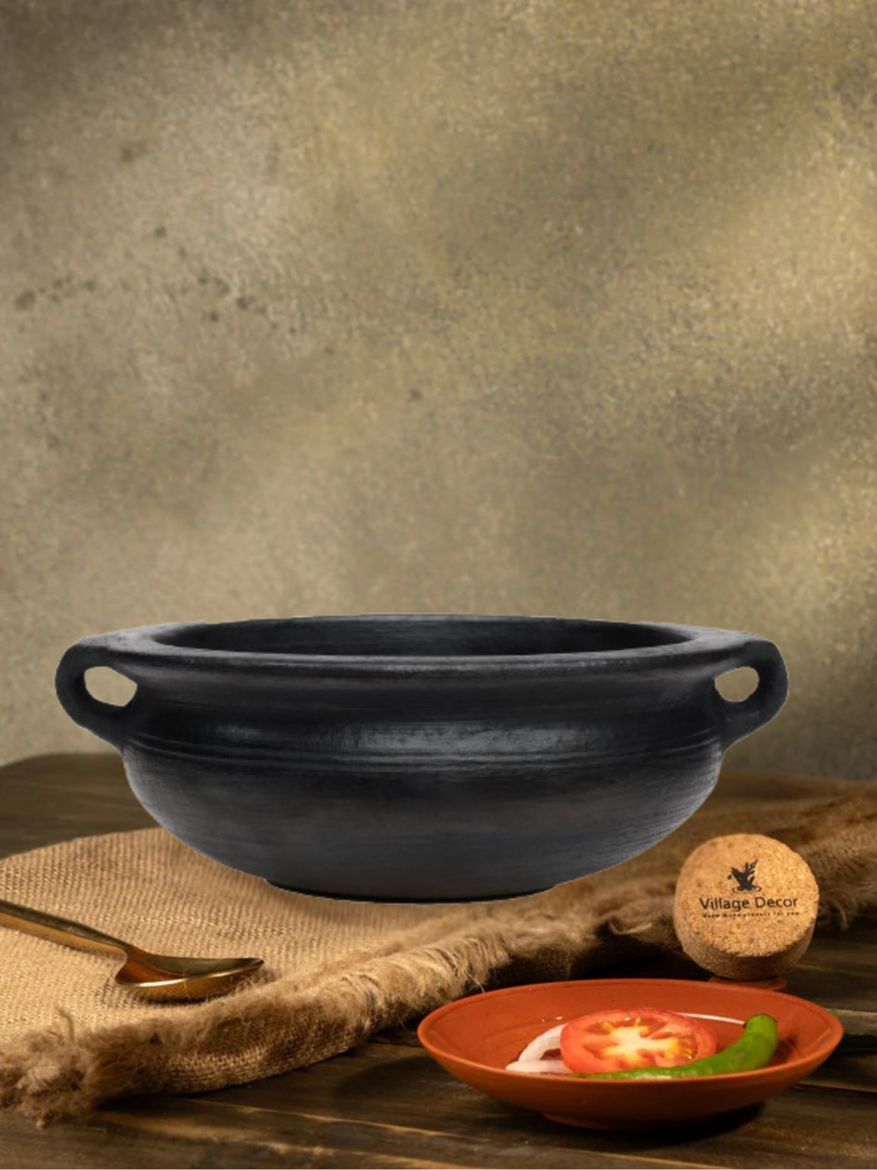 Earthen Black clay cooking pot ideal for preparing a variety of traditional dishes like veg Saute, Fish Curry etc.,
