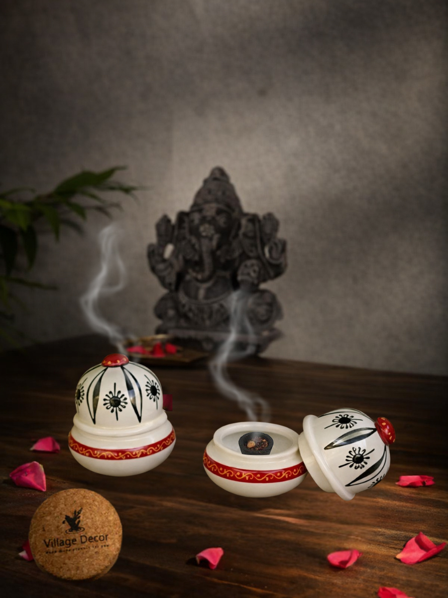 Handcrafted incense holder lifestyle view with dhoop cup setup for pooja decor, placed on wooden surface with rose petals and Ganesha idol in background.

