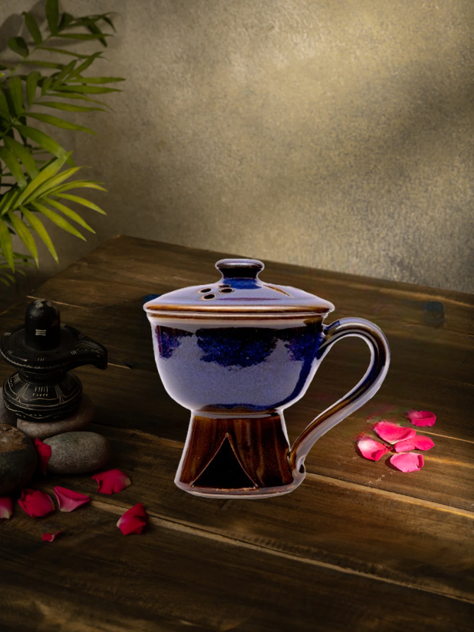 Handcrafted ceramic incense holder lifestyle view with rose petals.