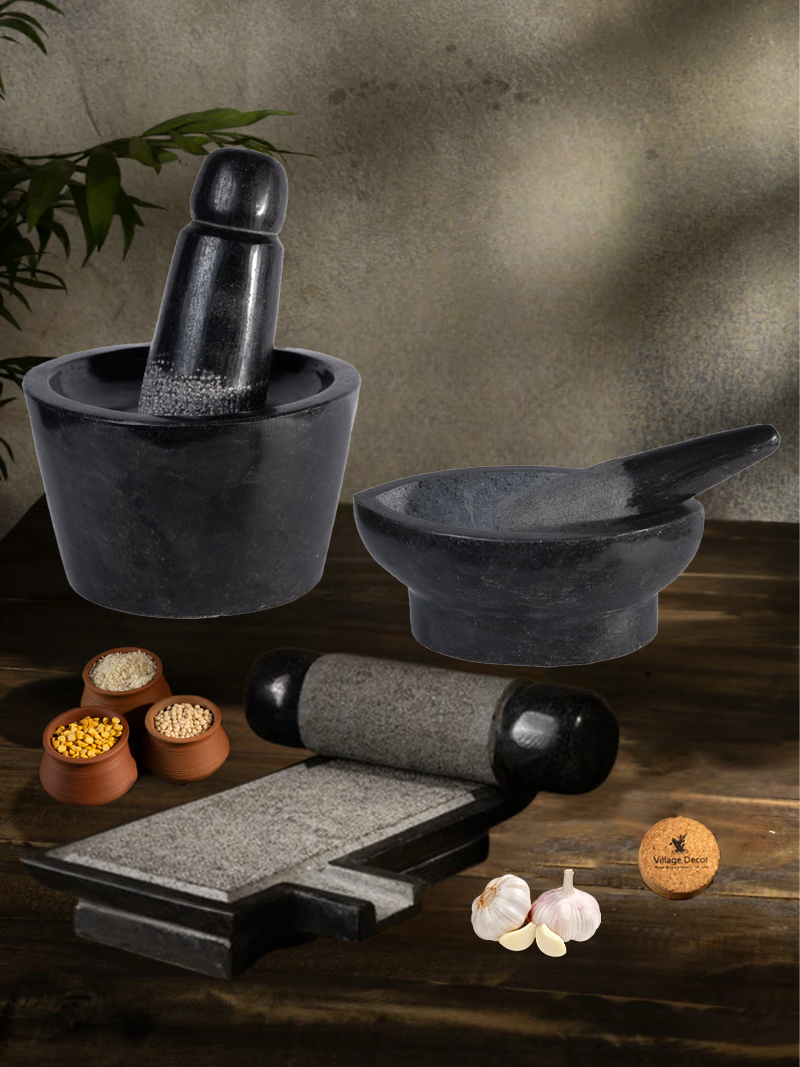 Handmade Silbatta, Rubbu Rolu and kharal stone kitchen tools placed on a rustic wooden surface with lentils and garlic for traditional cooking.
