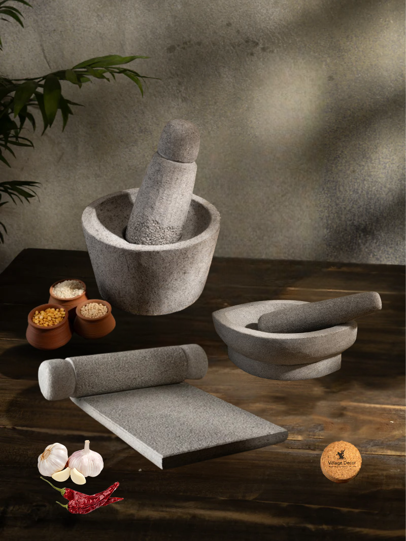 Handmade Silbatta, Rubbu Rolu and kharal stone kitchen tools placed on a rustic wooden surface with lentils and garlic for traditional cooking.
