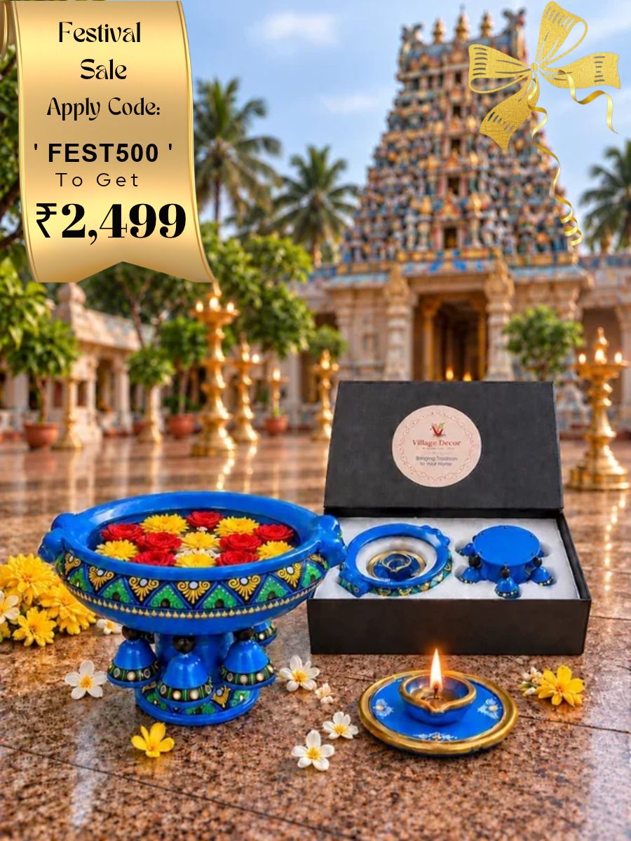 Temple blue handpainted terracotta urli with plate agal vilakku, styled in a traditional home decor setting to showcase temple-inspired craftsmanship, festive decoration, and elegant gifting in an exclusive gift box.