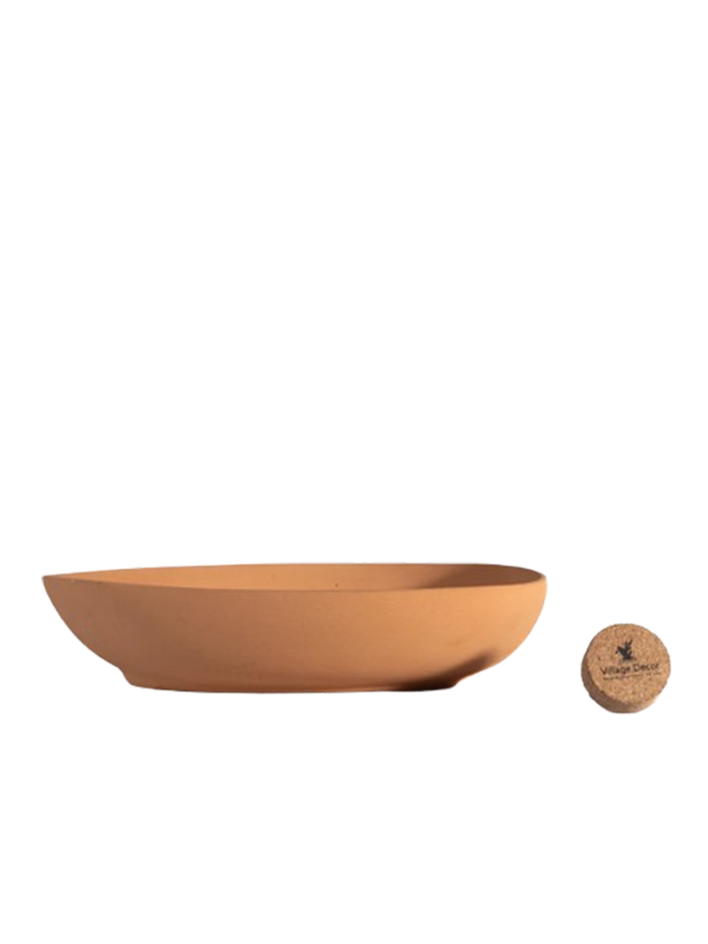 Uneven shape bonsai planter with white background view—perfect flower pot for indoor and garden spaces with a natural terracotta finish.
