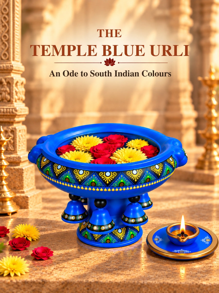 Temple Blue Urli showpiece vastu bowl with vibrant handpainted artwork, flower-filled design and diya, inspired by South Indian temple decor.
