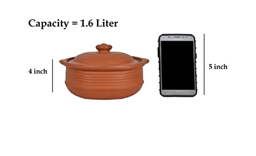 arthen clay cooking pot with lid, shown next to a 5-inch mobile phone for size comparison. Pot height is 4 inches.

